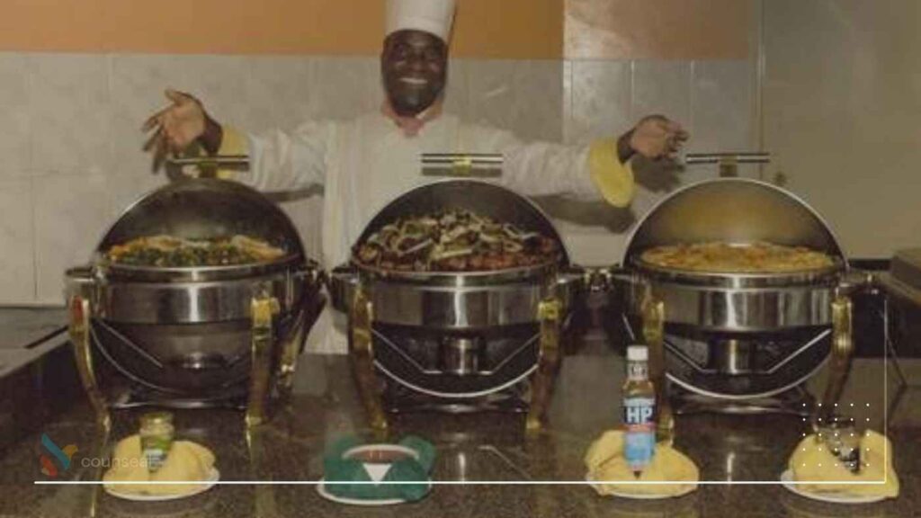 An image of a chef(s) standing behind chafing dishes